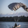 Military jumper beneath the Military Silhouette canopy preparing for an intentional water landing